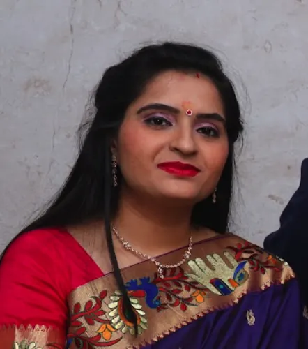 Dr. Kinjal Thakkar in a purple saree
